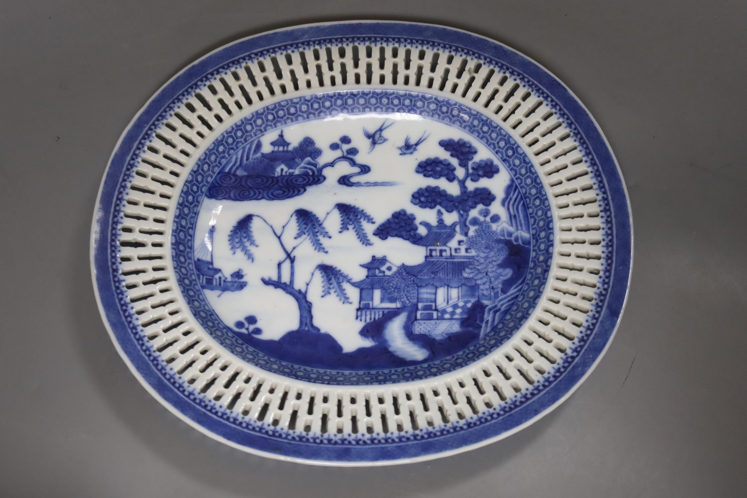 A Chinese blue and white chestnut basket and stand, Qianlong period, basket 11 cms high.